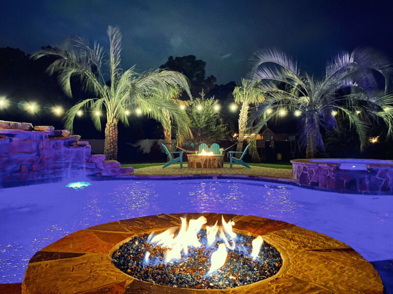 Freeform Pool with Spa, Fire Features, A Large Rock Waterfall and a Fire Pit Sitting Area Gulf Breeze FL