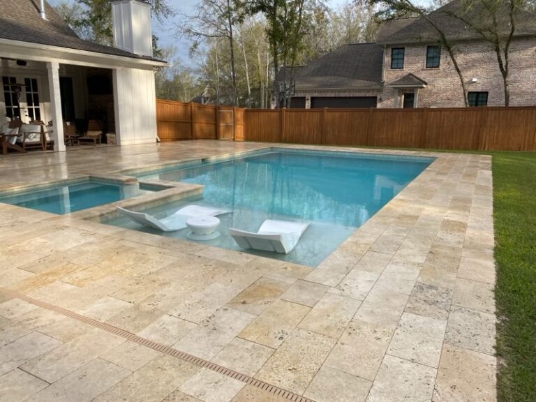 Rectangular Pool & Spa with Sunshelf and Loungers surrounded by Travertine Tiles Mobile AL