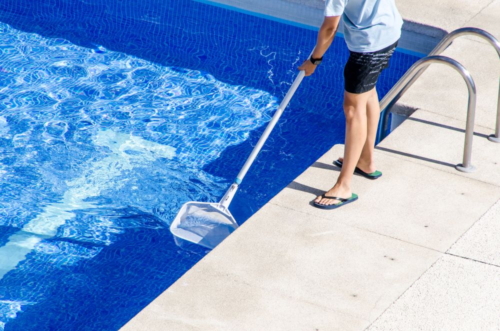 Man cleaning the pool