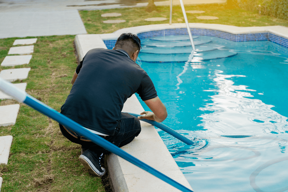 man checking the chemical levels in his saltwater pool